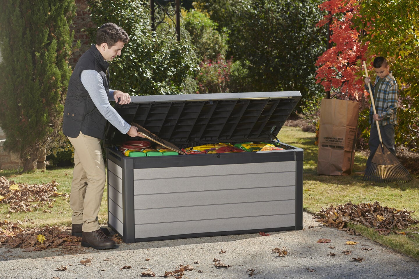 Man opening a Keter deck box