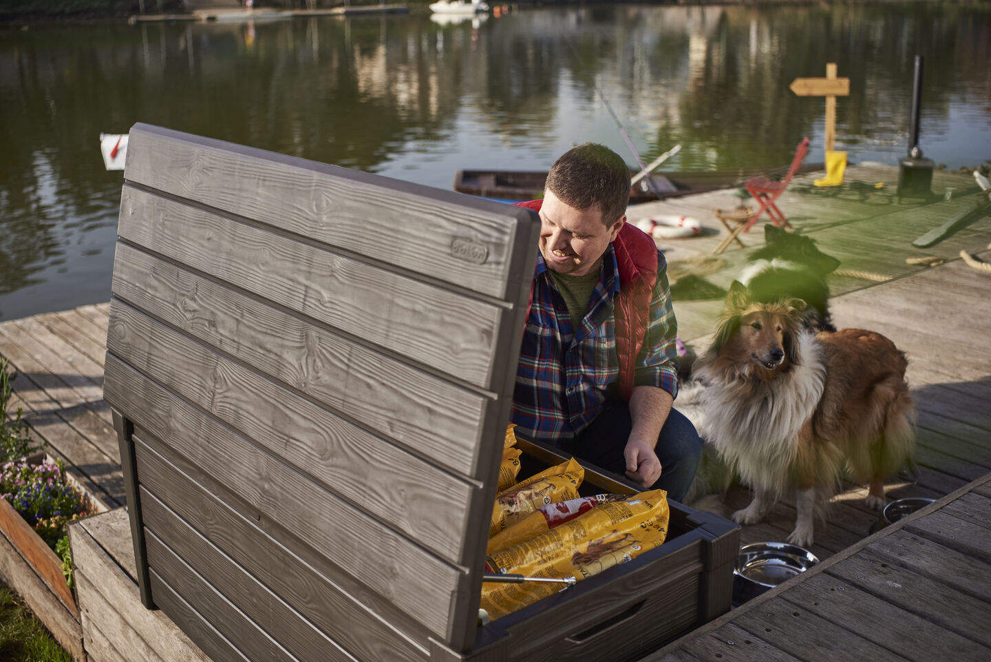 Man using a Brightwood storage box to store his pets dog food