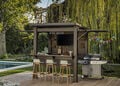 Keter BBQ Gazebo with grill and bunting in a garden setting