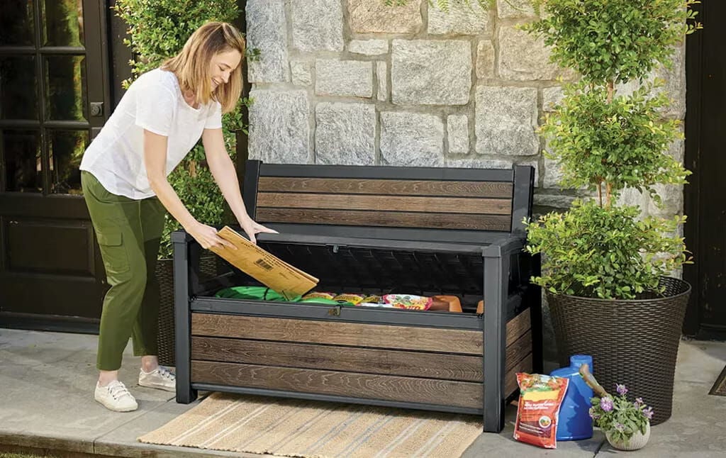 woman storing an item inside a storage bench