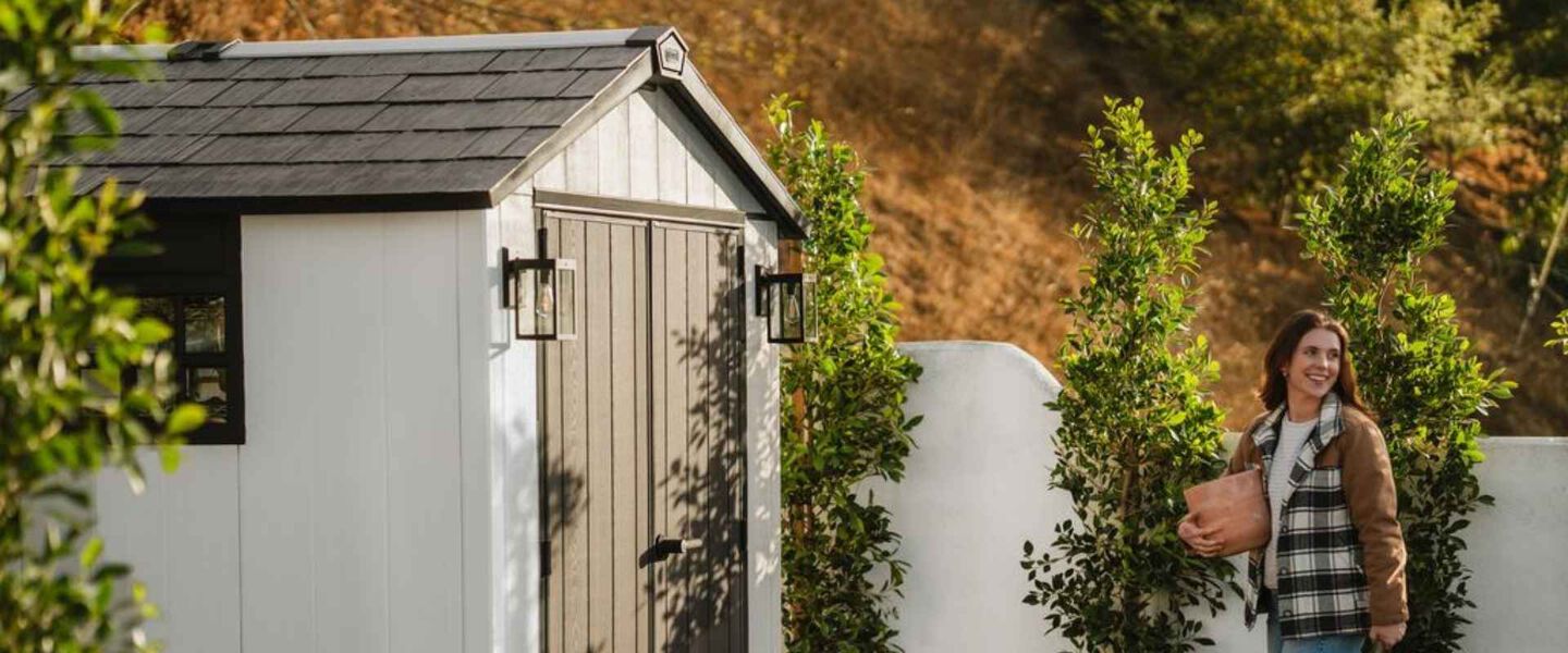 Keter Oakland shed painted in white with lights