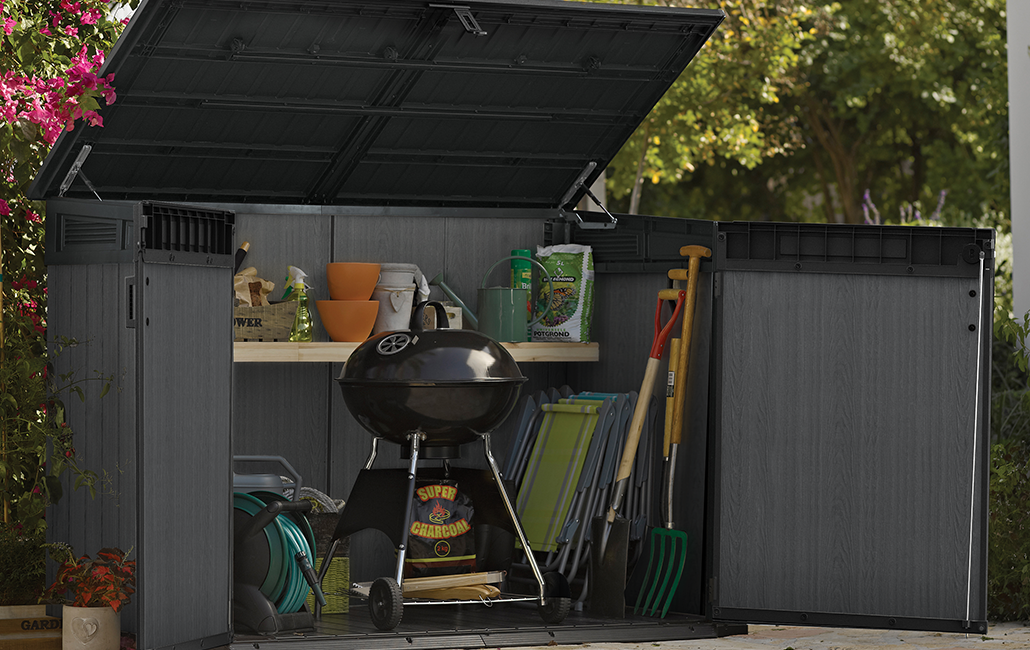 Open storage shed with a grill inside 