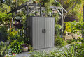 Premier Tall Storage Shed in a garden