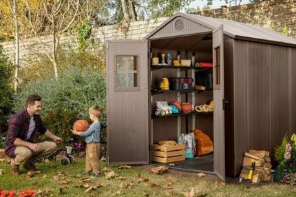 Outdoor storage shed with shelving kit.