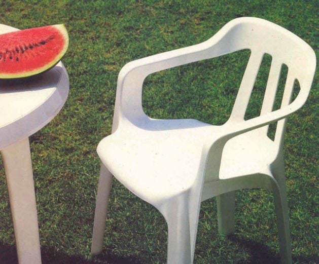 White keter monobloc chair in backyard