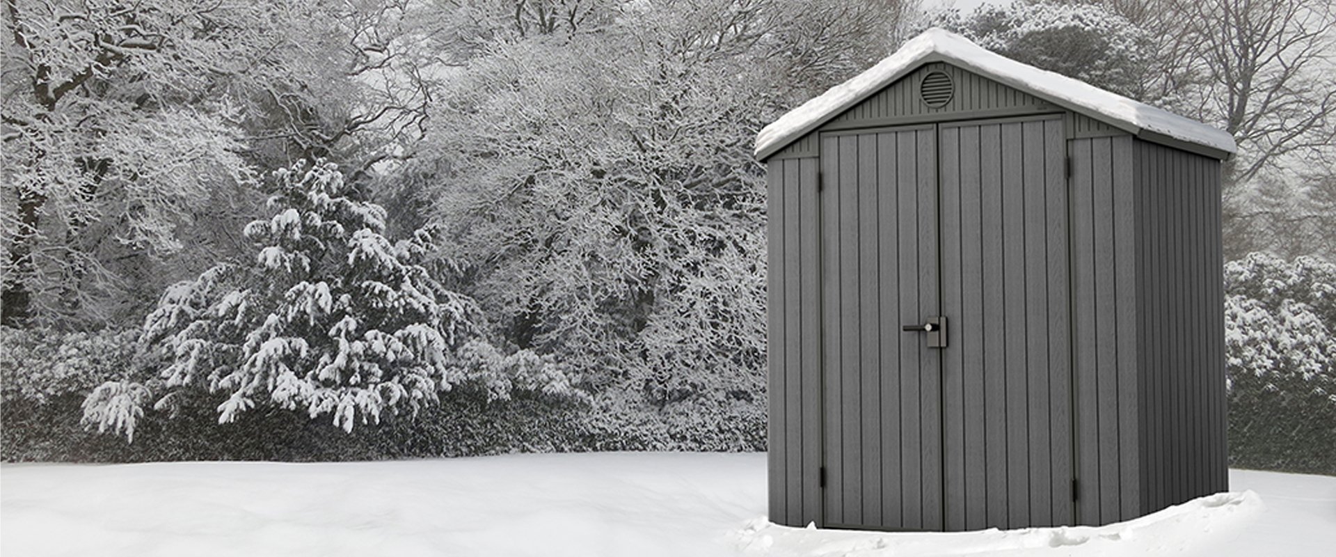 Green Keter Darwin 6x4 shed in the snow