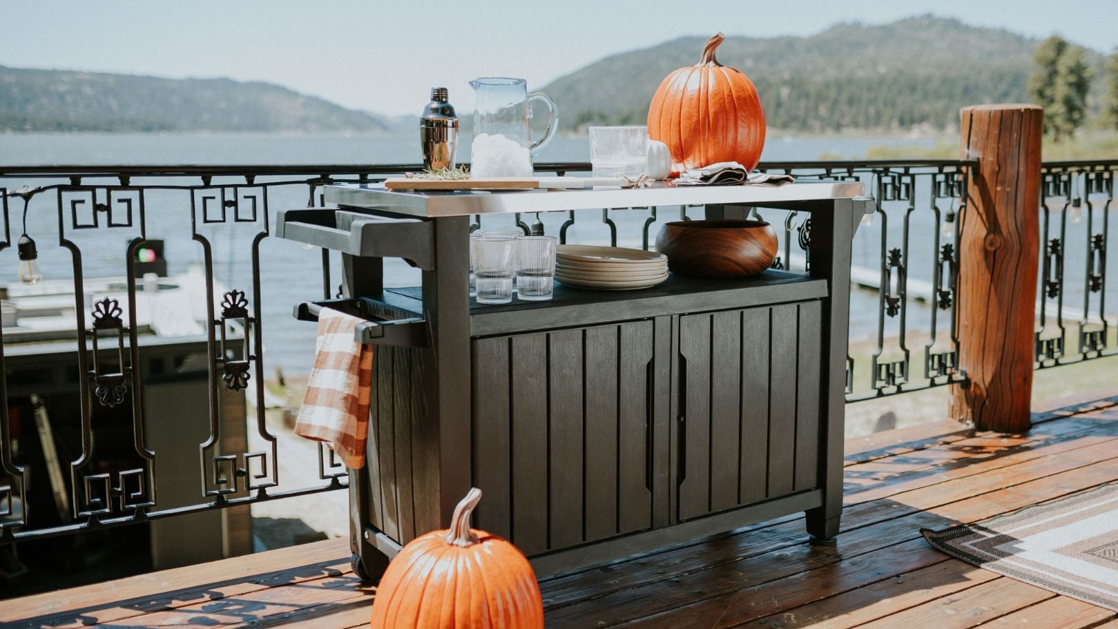 keter unity xl outdoor kitchen cart on patio with pumpkins