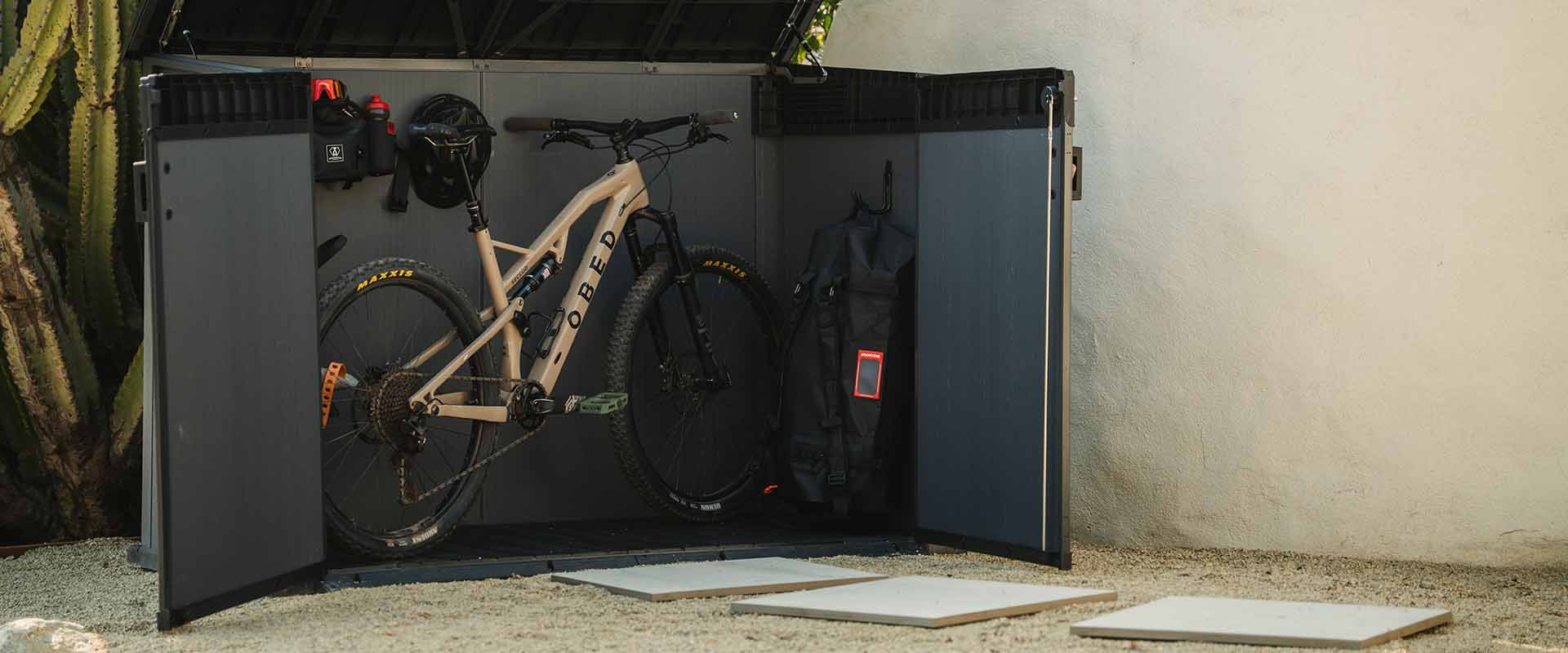 Small Gray Keter Cortina shed with Bicycle and Double Doors