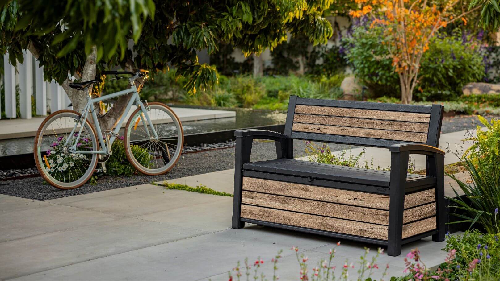 keter outdoor storage bench signature pine in backyard